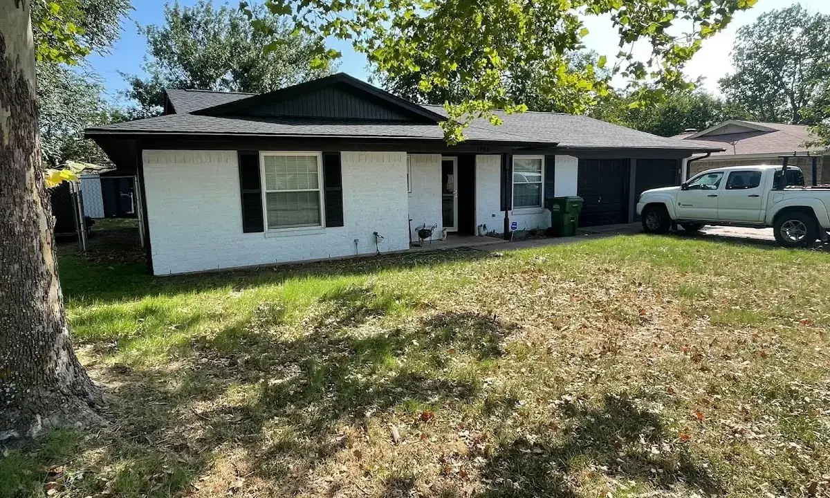 Professional roofing crew working on a residential roof in Grandview Heights